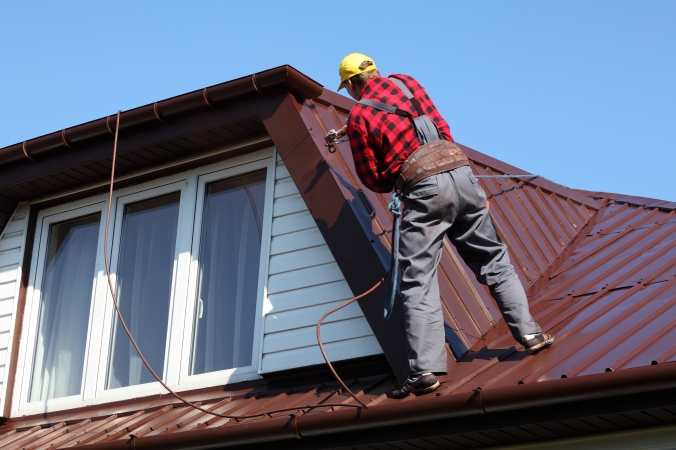 bigstock-roofer-builder-worker-with-pul-65643988.jpg